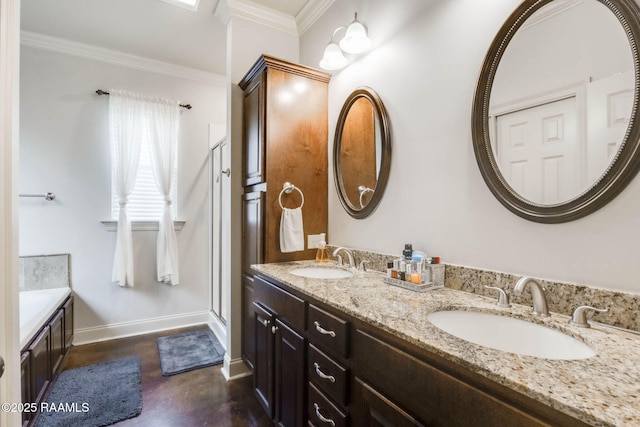 full bathroom with baseboards, crown molding, a sink, and double vanity