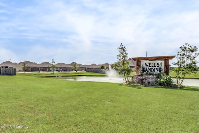 view of home's community with a lawn, a water view, and a residential view