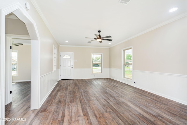 813 S Arenas St, Rayne, LA 70578 - foyer entrance featuring a wainscoted wall, visible vents, ornamental molding, dark wood-style flooring, and ceiling fan