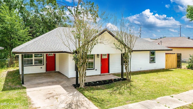 906 Priscilla Ln, Lafayette, LA 70501 - ranch-style house with concrete driveway, a shingled roof, a front lawn, and fence