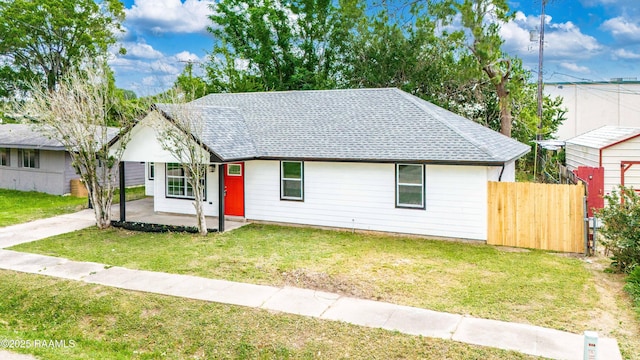 906 Priscilla Ln, Lafayette, LA 70501 - ranch-style house featuring a front lawn, fence, and roof with shingles