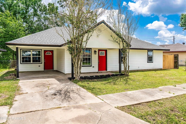 906 Priscilla Ln, Lafayette, LA 70501 - ranch-style home with a front lawn, fence, roof with shingles, and driveway