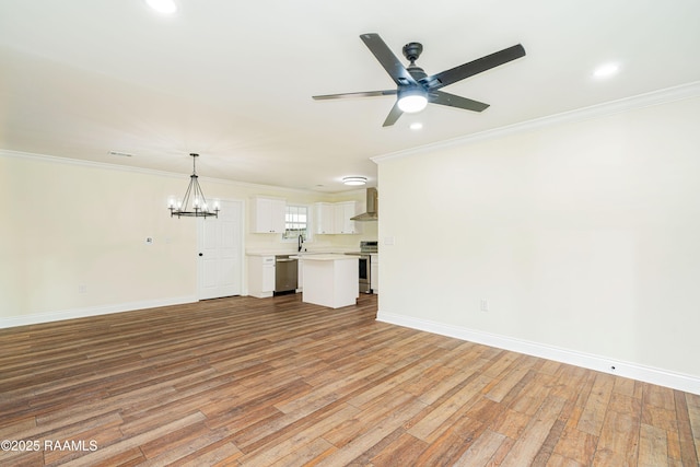 906 Priscilla Ln, Lafayette, LA 70501 - unfurnished living room with light wood-style floors, baseboards, ornamental molding, and ceiling fan with notable chandelier