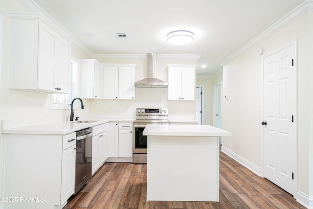 906 Priscilla Ln, Lafayette, LA 70501 - kitchen featuring crown molding, stainless steel appliances, wall chimney exhaust hood, dark wood-type flooring, and visible vents