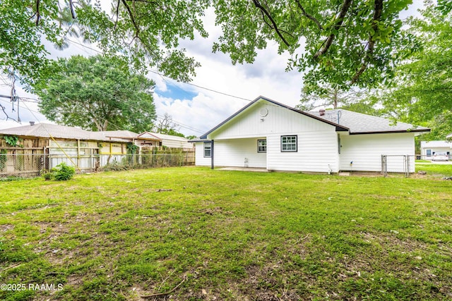 906 Priscilla Ln, Lafayette, LA 70501 - back of house featuring a fenced backyard and a yard