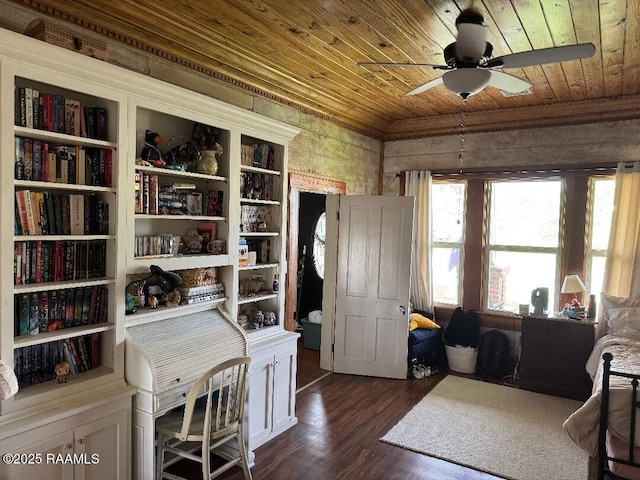 office space featuring wood ceiling, ceiling fan, ornamental molding, and dark wood-type flooring