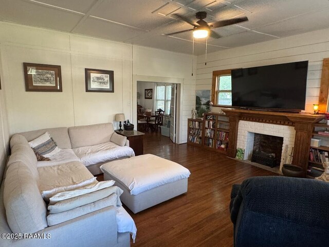 807 N Polk St, Rayne, LA 70578 - living area featuring ceiling fan, a brick fireplace, and wood finished floors