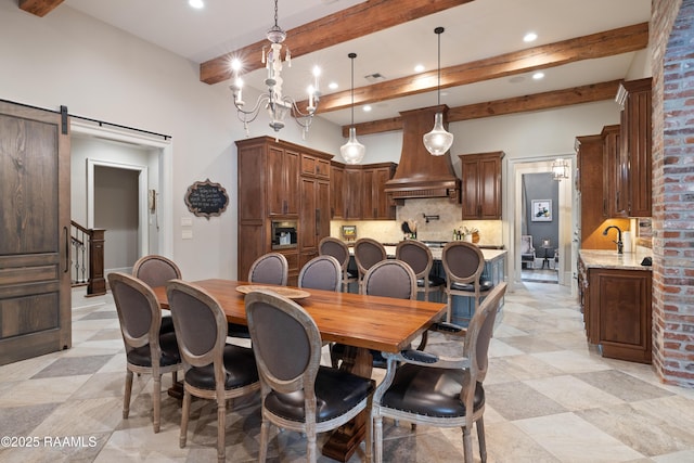 dining space featuring recessed lighting, beamed ceiling, a chandelier, and a barn door
