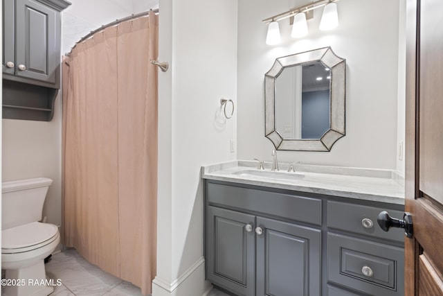 full bathroom featuring marble finish floors, vanity, and toilet