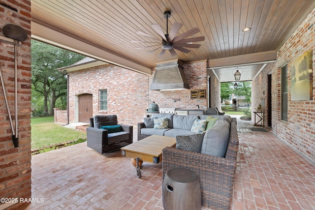view of patio / terrace with an outdoor living space, a ceiling fan, and area for grilling