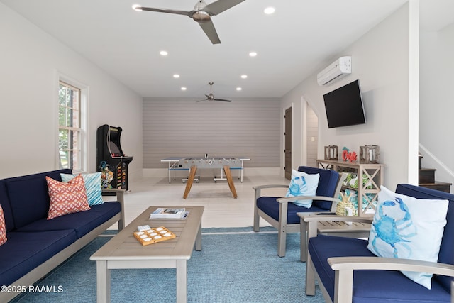 living room featuring a ceiling fan, recessed lighting, a wall mounted AC, stairway, and carpet
