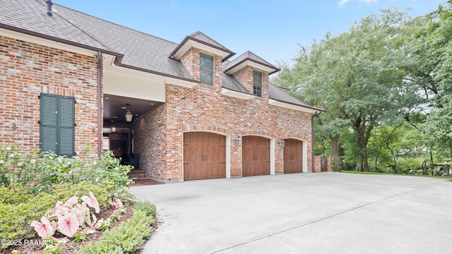 114 Daniel Ln, New Iberia, LA 70563 - view of front facade featuring brick siding, concrete driveway, and a garage