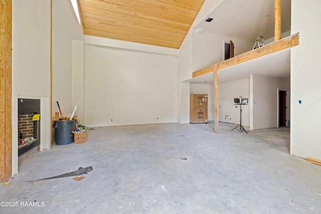 114 Daniel Ln, New Iberia, LA 70563 - unfurnished living room featuring high vaulted ceiling, wood ceiling, and unfinished concrete floors