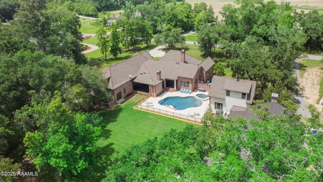 114 Daniel Ln, New Iberia, LA 70563 - view of subject property featuring a pool and a tree filled landscape