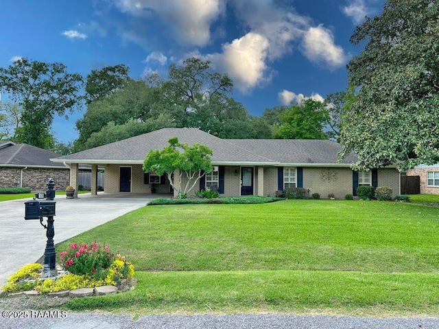 single story home featuring driveway, a carport, and a front lawn