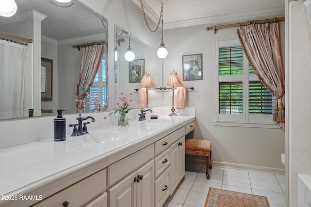 full bath with double vanity, ornamental molding, a sink, and tile patterned flooring