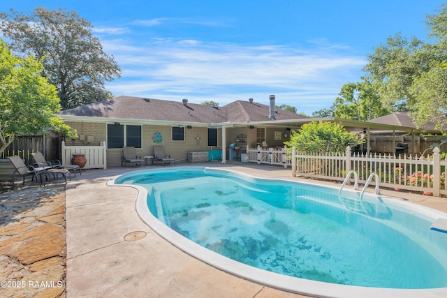 view of swimming pool with a fenced in pool, a patio area, and fence