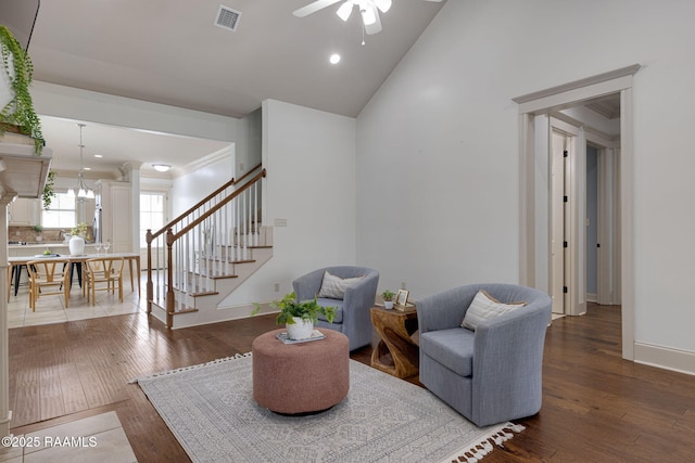 313 Summerland Key Ln, Lafayette, LA 70508 - sitting room with ceiling fan, decorative columns, visible vents, stairs, and hardwood / wood-style floors