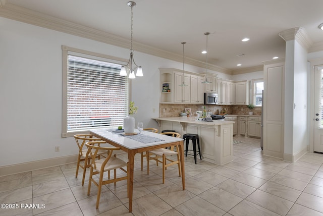 313 Summerland Key Ln, Lafayette, LA 70508 - dining area with recessed lighting, baseboards, and ornamental molding
