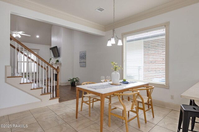313 Summerland Key Ln, Lafayette, LA 70508 - dining room featuring visible vents, crown molding, stairs, baseboards, and ceiling fan with notable chandelier