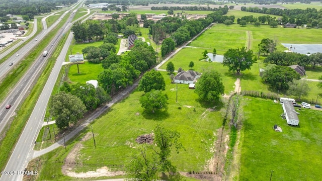 birds eye view of property with a rural view
