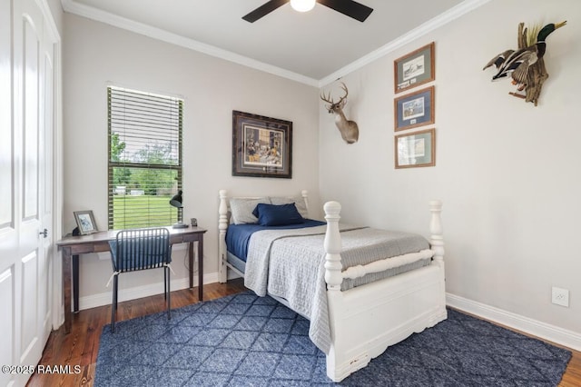 bedroom with ceiling fan, baseboards, crown molding, and wood finished floors