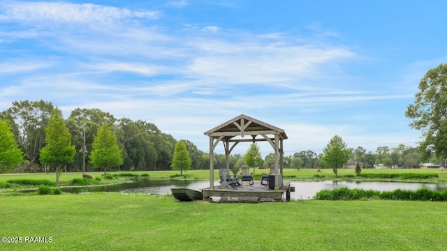 view of property's community featuring a gazebo, a water view, and a lawn