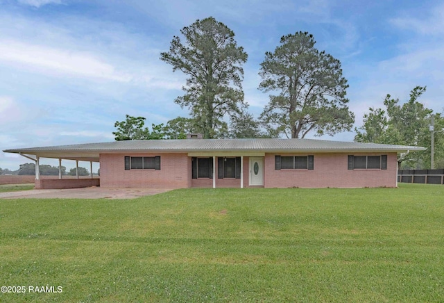 1706 Fuselier Rd, Arnaudville, LA 70512 - view of front of home with brick siding, a carport, and metal roof
