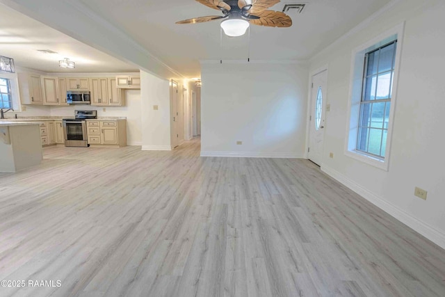 1706 Fuselier Rd, Arnaudville, LA 70512 - unfurnished living room featuring a ceiling fan, light wood-style flooring, baseboards, and a sink