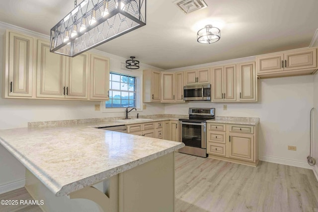 1706 Fuselier Rd, Arnaudville, LA 70512 - kitchen featuring stainless steel appliances, cream cabinets, light countertops, a peninsula, and crown molding