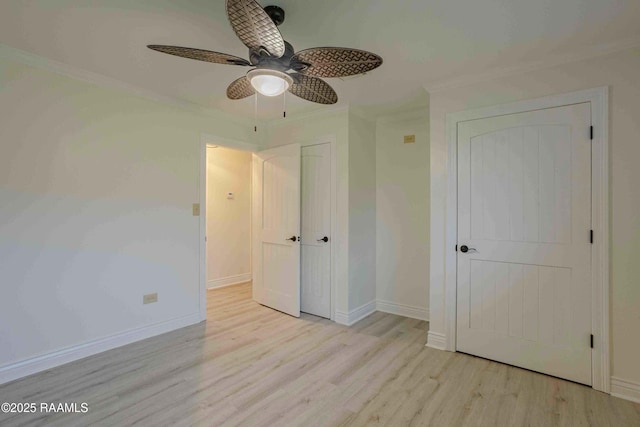 1706 Fuselier Rd, Arnaudville, LA 70512 - unfurnished bedroom featuring wood finished floors, crown molding, baseboards, and a ceiling fan