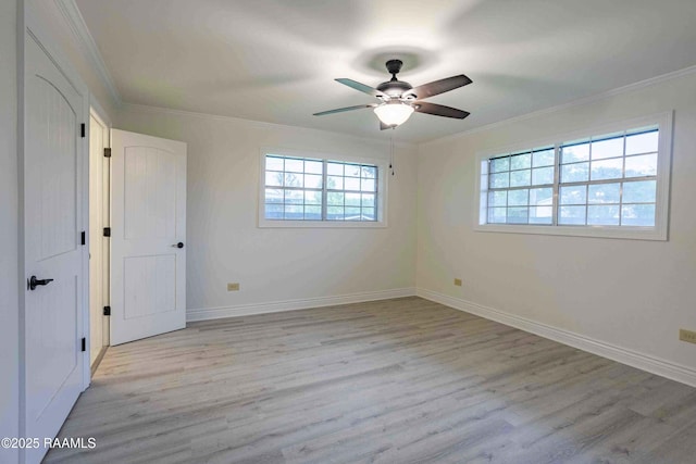 1706 Fuselier Rd, Arnaudville, LA 70512 - unfurnished bedroom featuring light wood-style flooring, crown molding, baseboards, and a ceiling fan