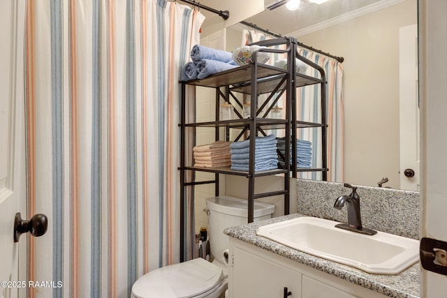 211 Versailles Blvd Unit 5, Lafayette, LA 70501 - bathroom featuring vanity, ornamental molding, toilet, and a shower with curtain