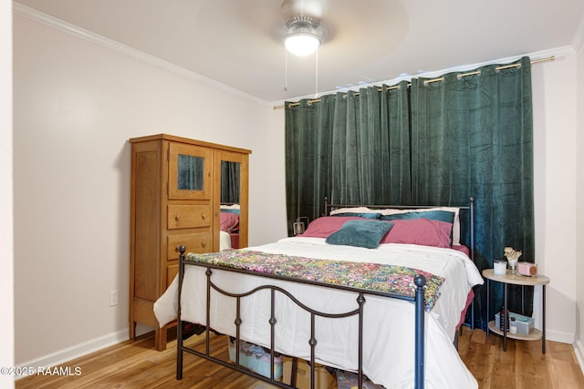 211 Versailles Blvd Unit 5, Lafayette, LA 70501 - bedroom with baseboards, ornamental molding, and wood finished floors