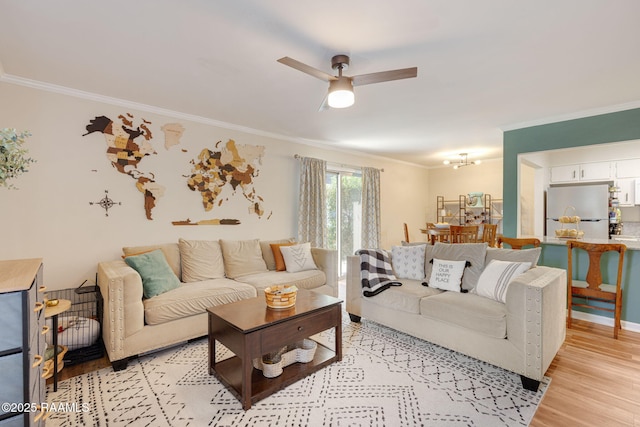 211 Versailles Blvd Unit 5, Lafayette, LA 70501 - living room with crown molding, ceiling fan, and light wood-style flooring