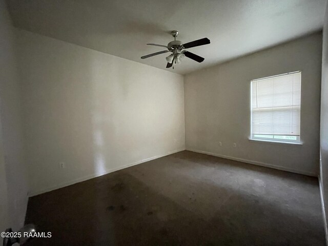 unfurnished room with a ceiling fan, baseboards, and carpet floors