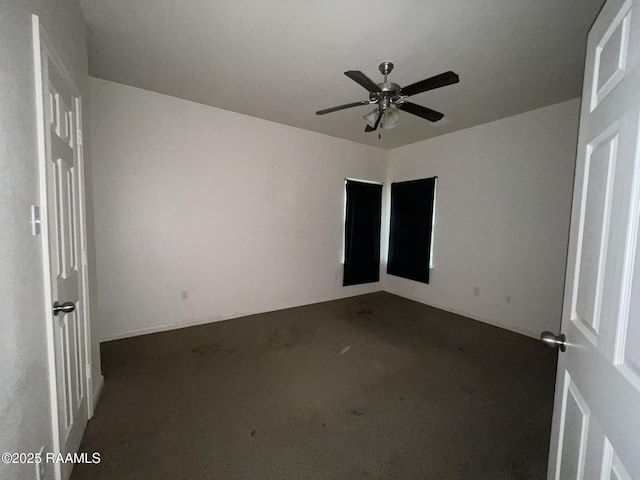 unfurnished room featuring carpet and ceiling fan