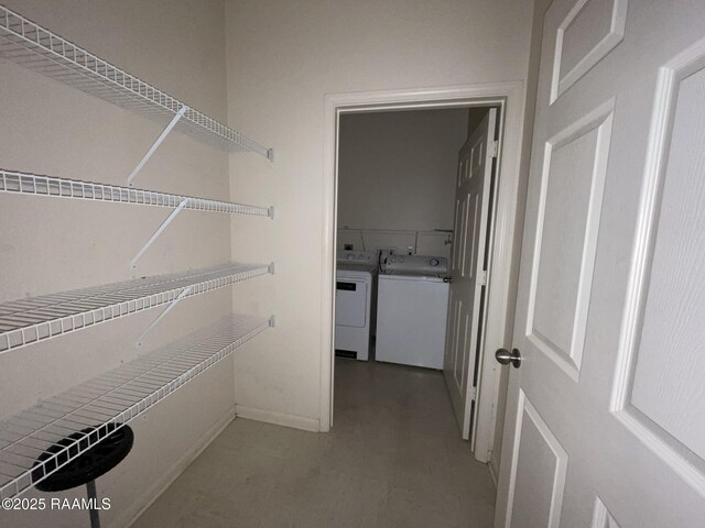 spacious closet featuring separate washer and dryer
