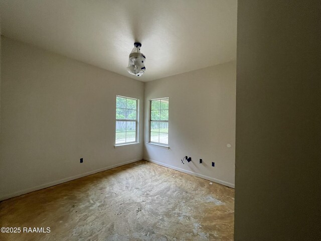 empty room with baseboards