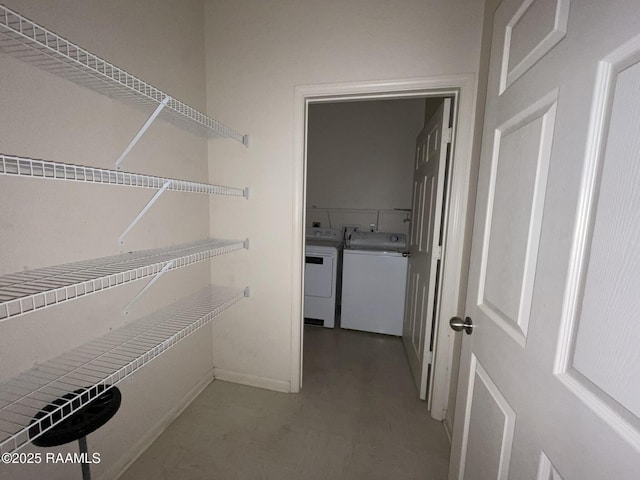 spacious closet featuring separate washer and dryer
