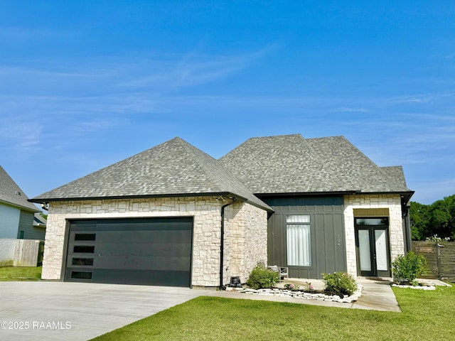 104 Cherrywood Dr, Lafayette, LA 70508 - french country inspired facade featuring board and batten siding, roof with shingles, a garage, and concrete driveway
