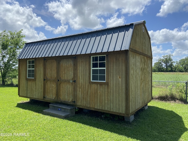 view of shed with fence