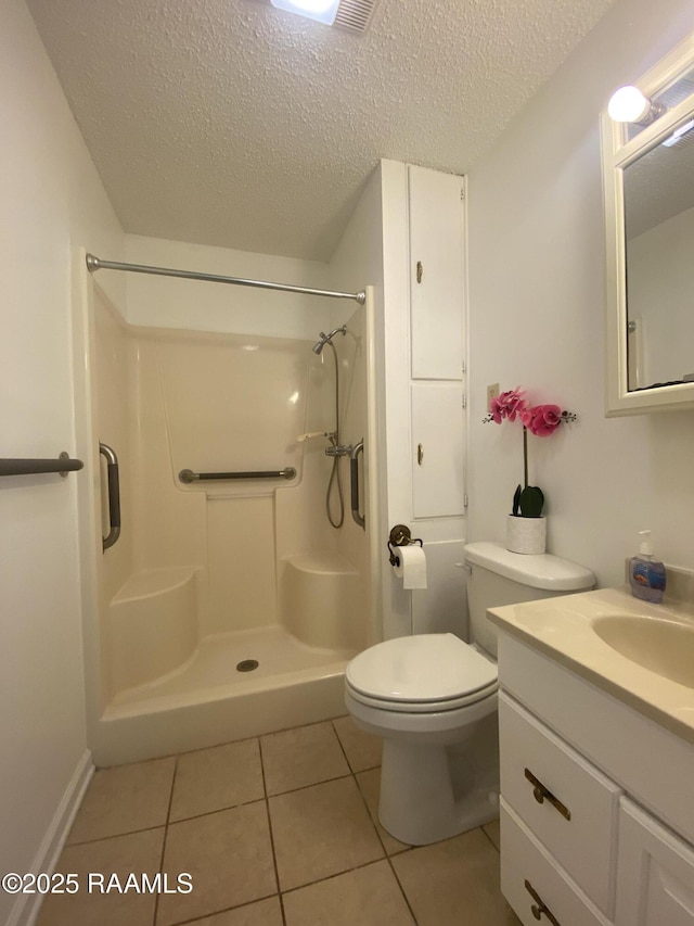 bathroom featuring a textured ceiling, walk in shower, and tile patterned floors