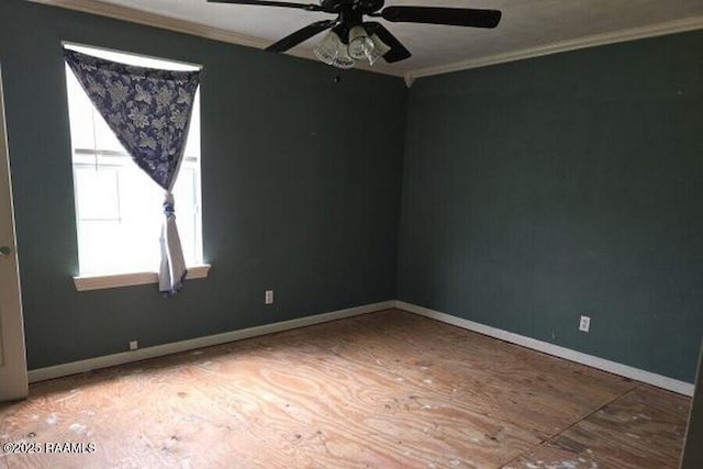 unfurnished room featuring ceiling fan, ornamental molding, and baseboards