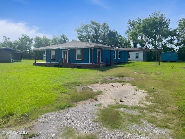 428 Nonc Lol Dr, Arnaudville, LA 70512 - ranch-style house with a front lawn and gravel driveway