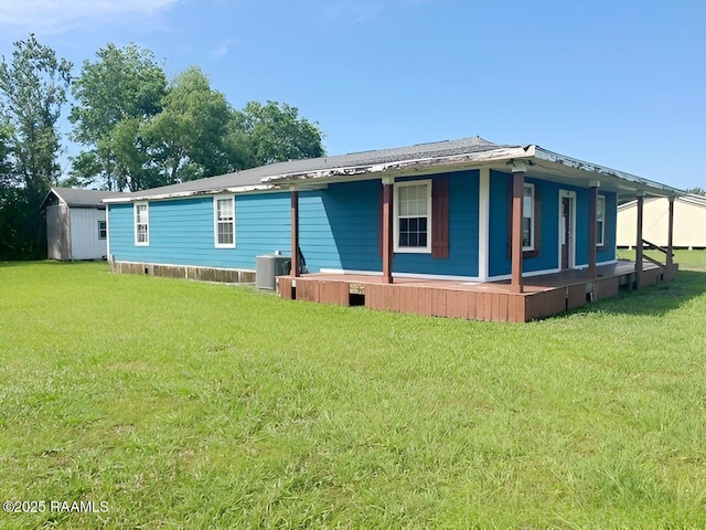 428 Nonc Lol Dr, Arnaudville, LA 70512 - exterior space with a lawn, an outdoor structure, central air condition unit, and a shed