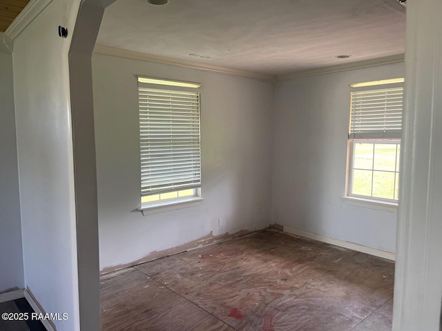 428 Nonc Lol Dr, Arnaudville, LA 70512 - spare room with crown molding and arched walkways