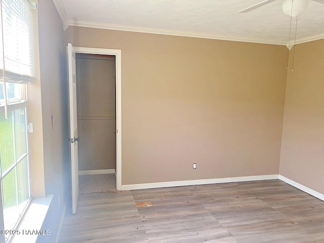 428 Nonc Lol Dr, Arnaudville, LA 70512 - spare room featuring baseboards, ornamental molding, a ceiling fan, and wood finished floors