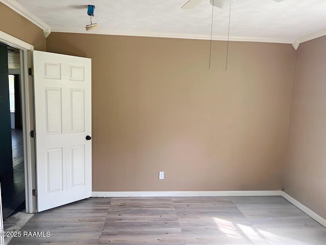 428 Nonc Lol Dr, Arnaudville, LA 70512 - spare room featuring crown molding, baseboards, a ceiling fan, and wood finished floors