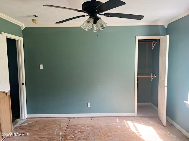 428 Nonc Lol Dr, Arnaudville, LA 70512 - unfurnished bedroom with crown molding, a ceiling fan, baseboards, and a closet